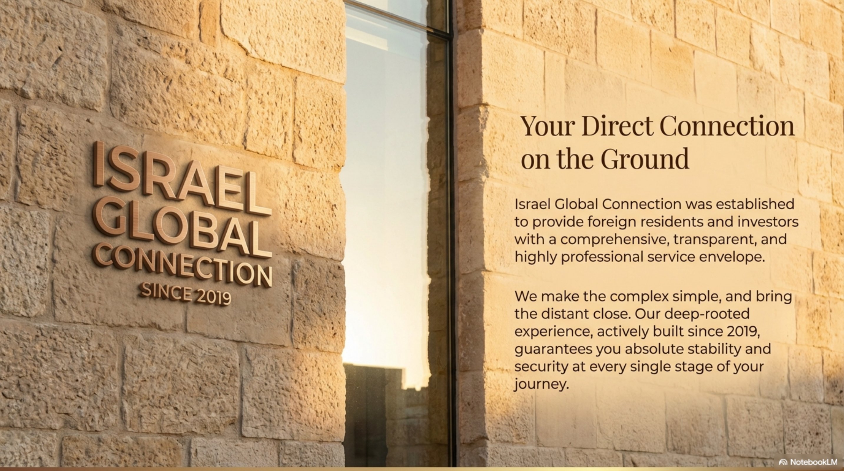 A stone facade with the Israel Global Connection mark in bronze, illuminated by sunlight